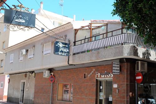 a building with a balcony on top of it at La coqueta in Murcia