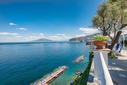 a view of a body of water with a pot on a wall at Grand Hotel Riviera in Sorrento