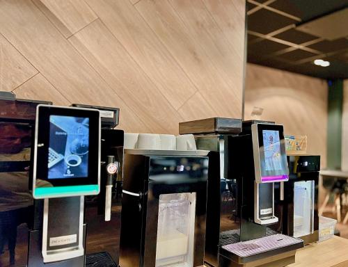 a group of computer monitors on display in a store at LUNA Self Check-in Hotel Klaipeda in Klaipėda