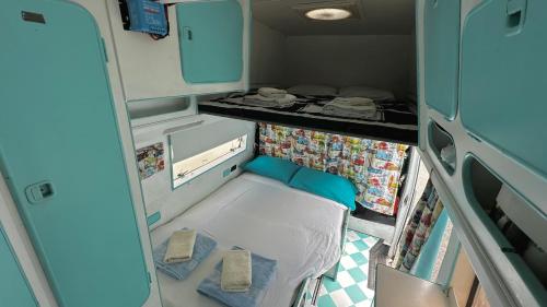 a small room with two chairs in an rv at Autocaravana Dory in Lisbon