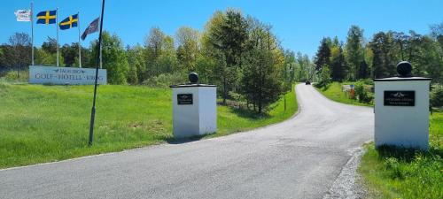 an empty road with two toll booths on the side at Villa Strömma Värmdö - Sthlm archipelago, comfortable & fully equipped, 35 min from city center in Värmdö