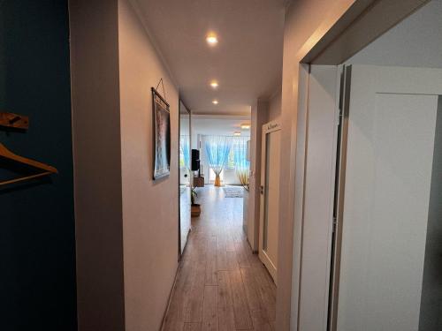 a long hallway with a hallway at Green Tea Apartment Warsaw Centrum in Warsaw