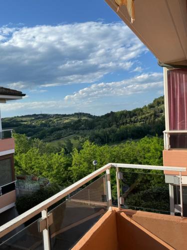 a balcony of a building with a view of trees at Appartamento Silvia in Santa Veneranda
