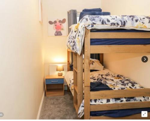 a bunk bed room with two bunk beds at Whitby Central walk to Beach Pier Flowergate in Whitby