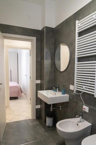 a bathroom with a sink and a mirror at B&B Cateum in Andria