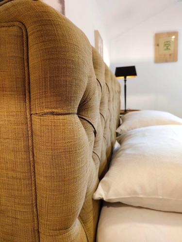 a row of pillows lined up against a wall at Pension Zita in Schoppernau