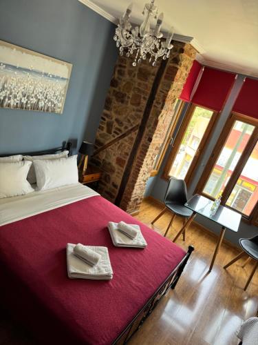 A bed or beds in a room at Ionia rooms