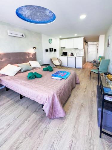 a bedroom with a large bed in a room at Ponderosa 210 Casa la Luna in Playa Fañabe