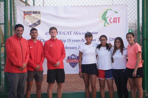 a group of people standing on a tennis court at Grand Plaza Sheikh Zayed in Kafr Abū ʼumaydah