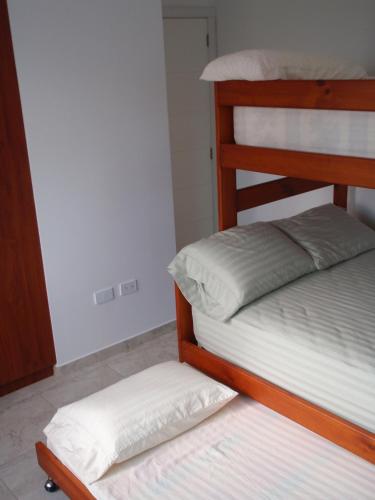 Postel nebo postele na pokoji v ubytování Beach front Condo Tonsupa near Atacames Ecuador