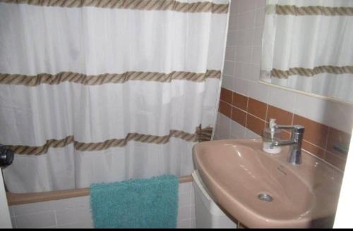 a bathroom with a sink and a shower at Apartamento Tossa in Tossa de Mar