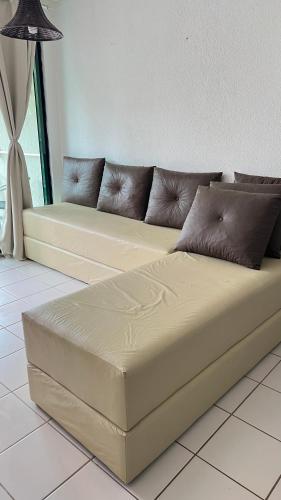 a large couch sitting in a living room at Muro Alto -Flat - Porto de Galinhas Beira mar in Porto De Galinhas