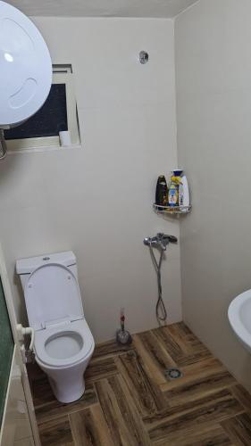a bathroom with a toilet and a sink at Sol Apartments Gjiri Lalzit in Durrës
