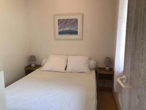 Ένα ή περισσότερα κρεβάτια σε δωμάτιο στο T2 Cabine St Lary Village au calme 4/5 pers 33m2