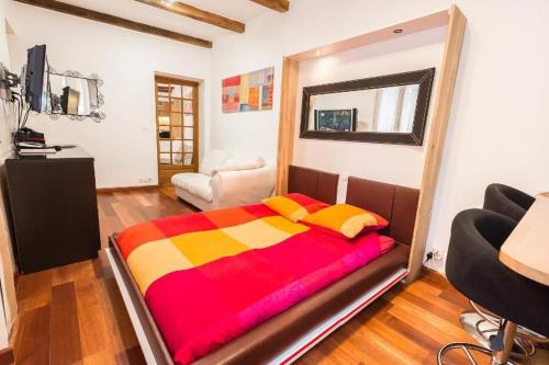 a bedroom with a large bed in a room at Abbesses Montmartre Apartment in Paris