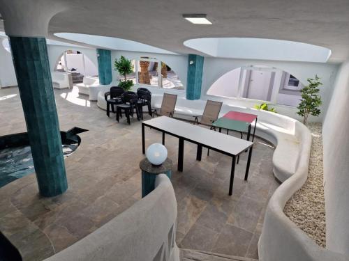 a living room with couches and a table and chairs at Gaviotas Beach Golf in Almerimar