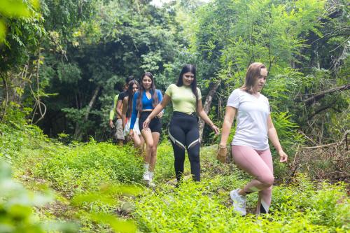 a group of women walking down a trail at Departamento exclusivo en Puerto Vallarta in Ixtapa