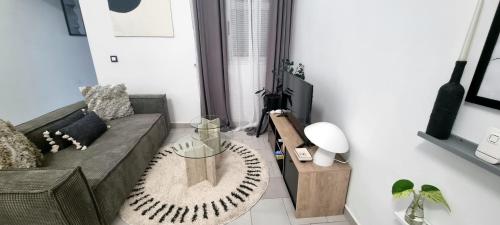 a living room with a couch and a table at Résidences C-Irène Angré in Abidjan