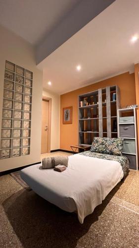 a bedroom with a large bed in a room at Casa La Dolce Pesca in Genoa
