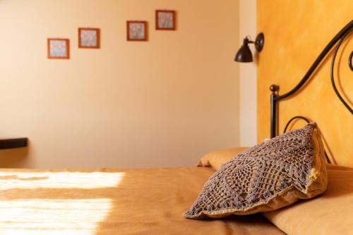 Katil atau katil-katil dalam bilik di Agriturismo El Crear