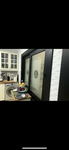 a kitchen with a table with a plate on it at villa amplia y acogedora-alcudia smir in Fnidek