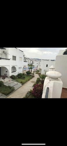 a view of a street with white buildings at villa amplia y acogedora-alcudia smir in Fnidek