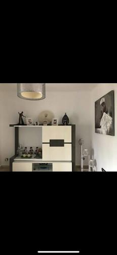 a kitchen with a white dresser in a room at villa amplia y acogedora-alcudia smir in Fnidek