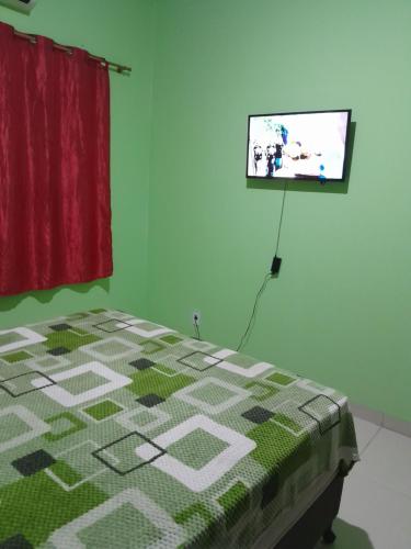 Giường trong phòng chung tại CASA RONDÔNIA RURAL SHOW