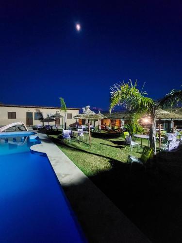 a view of a swimming pool at night at LA GRANJA in Tetouan
