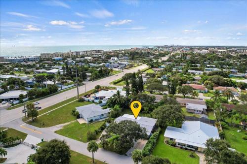 an aerial view of a town with a yellow sign at Coastal Chic Home, Walk to Beach in Cocoa Beach