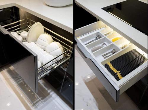 two pictures of an open drawer in a kitchen at DELUXE VILLA 4 phòng ngủ 5 giường lớn in Hue