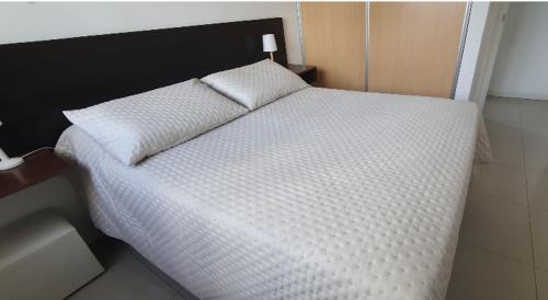 Ένα ή περισσότερα κρεβάτια σε δωμάτιο στο Apartamento en Luna Azul 2