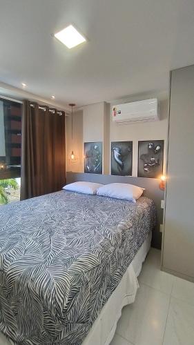 En eller flere senger på et rom på Apartamento em João Pessoa a 50 metros da Praia