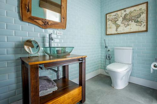 a bathroom with a sink and a toilet at Villa Sueño Azul - Blue Venao 3BR in Playa Venao