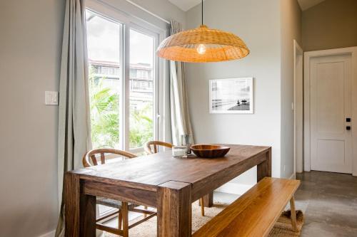 a dining room with a wooden table and chairs at Villa Sueño Azul - Blue Venao 3BR in Playa Venao