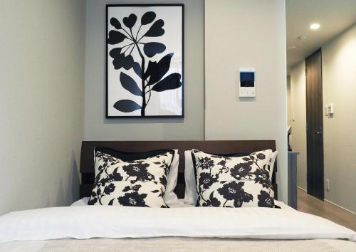 Ένα ή περισσότερα κρεβάτια σε δωμάτιο στο LANG Hotel Kameido#Near Akihabara#チェックアウトのみ清掃あり