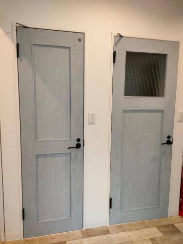 two doors in a room next to each other at LILY's House in Sano