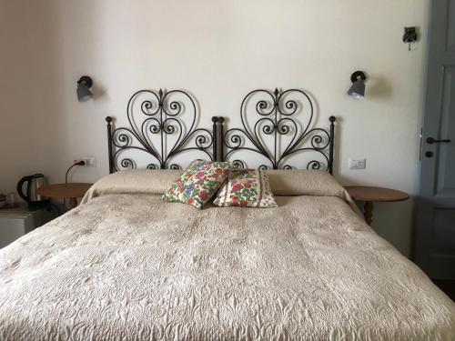 Postel nebo postele na pokoji v ubytování Agriturismo La Casa delle Fate