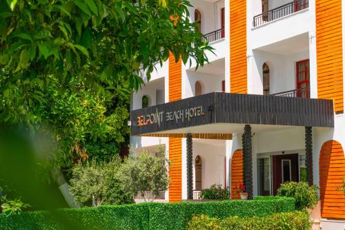 a building with a sign on the front of it at BELPOİNT BEACH HOTEL in Antalya
