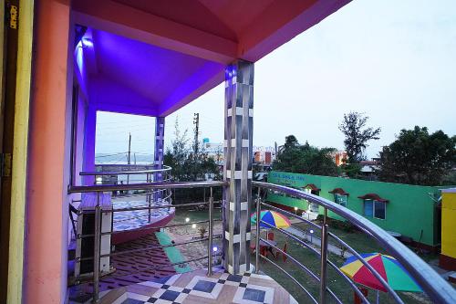 a view from a balcony of a playground at Sea Smile Inn in Mandarmoni