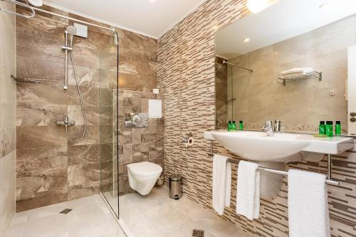 Koupelna v ubytování Hotel Compliment