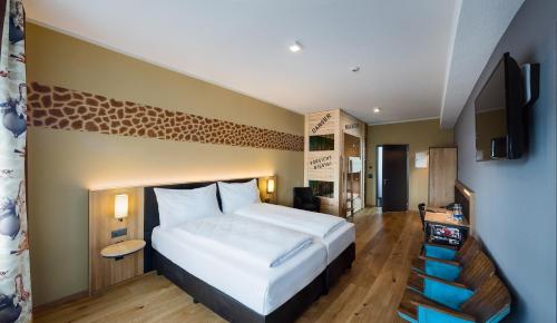 Postel nebo postele na pokoji v ubytování Hotel Cinema 8