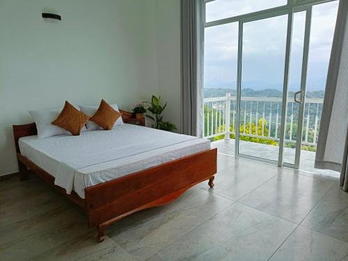 a bedroom with a bed and a large window at 259 Residencies in Kandy