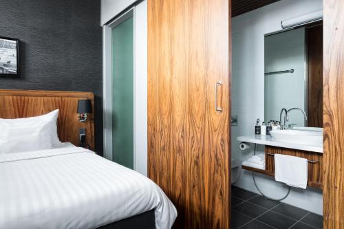 Postel nebo postele na pokoji v ubytování Home Hotel Katajanokka