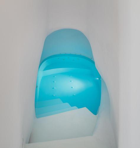 a view from the inside of a toilet seat at Trieris Villa & Suites in Fira