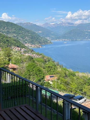 a view of the water from a balcony at Lago Maggiore - Traumbalkon mit Seeblick & Pool und 2 SZ in Oggebbio