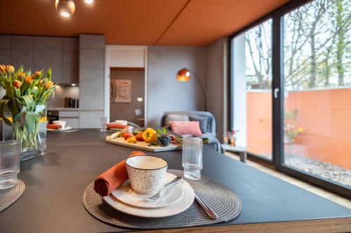 a table with a cup of coffee on top of it at 3-Zi-Wohlfühl-Oase „Down2Earth“ in Leonberg