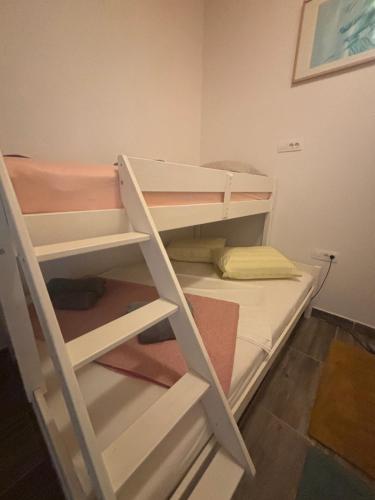 a couple of bunk beds in a room at Luxury house Ivan with 4 bedrooms in Divojevići
