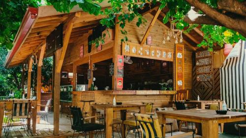 a restaurant with tables and chairs in front of it at Sheriff, Olympos in Kumluca