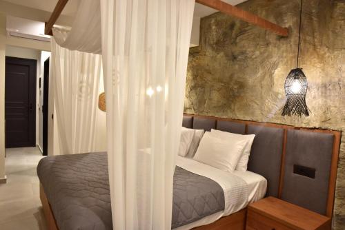Кровать или кровати в номере Rafael Hotel-Adults Only